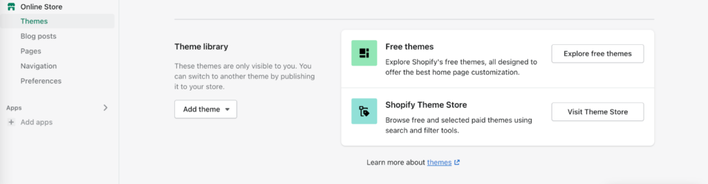 Página de temas de Shopify con botones para buscar temas gratuitos y visitar la tienda de temas
